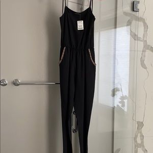 Black jumpsuit w/pocket accents